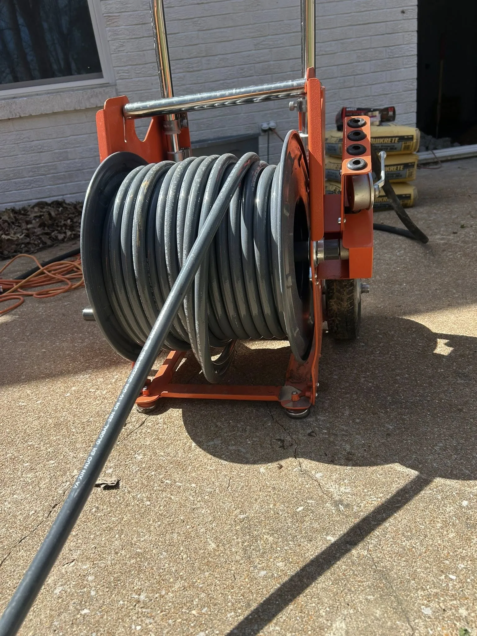 Hydro jetter hose reel set up on a customer’s driveway